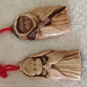 pair of vintage handmade ceramic ornaments